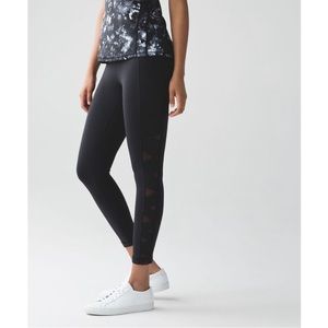 Black lululemon full-length leggings with mesh details on side.